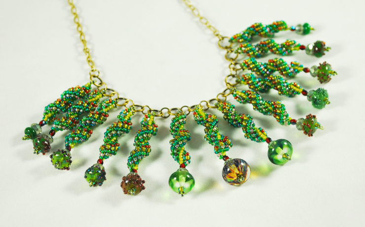 Christmas Necklace featuring handmade glass beads and bead-woven components made by Svetlana