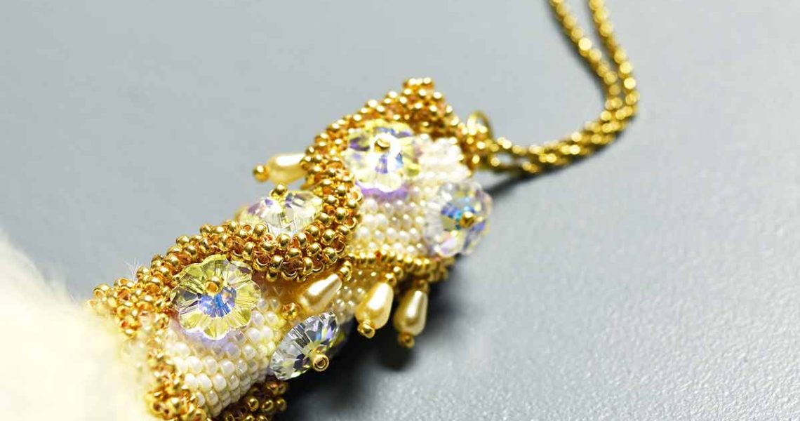 White Feather Beaded Pendant